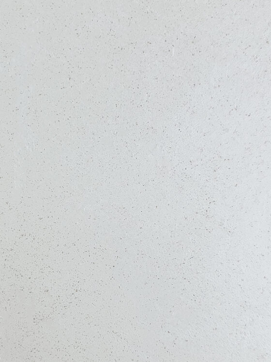 A Kasanai microcement colour sample in pearl, showing the pale refined tone of hand-applied Mortex.
